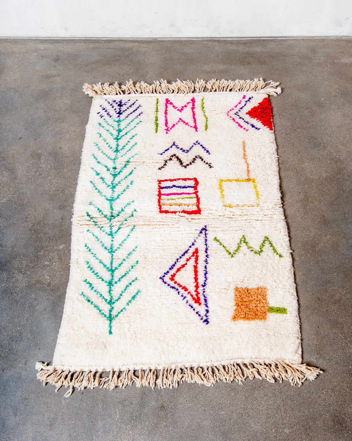 Modern, designer, handcrafted Berber rug from Morocco. Beniourain carpet with beautiful colours and patterns and fluffy wool texture.